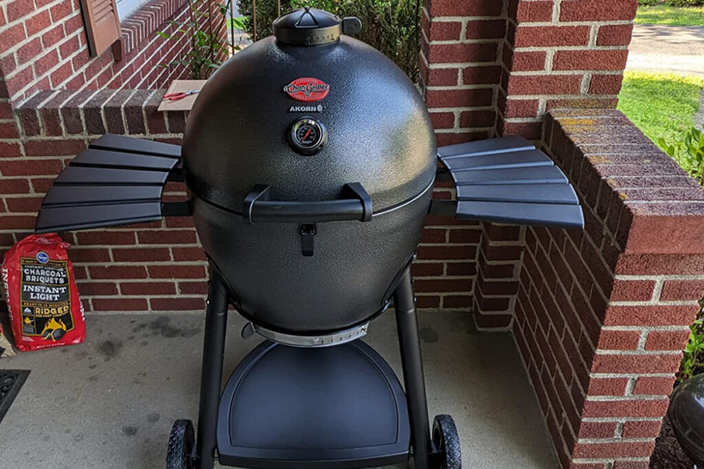 Char-Griller AKORN Kamado Grill and Smoker showcasing its durable design and versatile cooking capabilities, perfect for outdoor grilling and smoking enthusiasts.