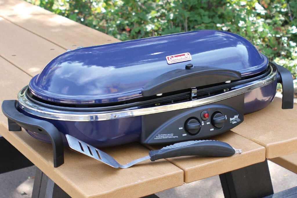 Image of the Coleman RoadTrip LX Collapsible Propane Grill showcasing its sleek design and portable features, perfect for outdoor cooking and camping adventures.