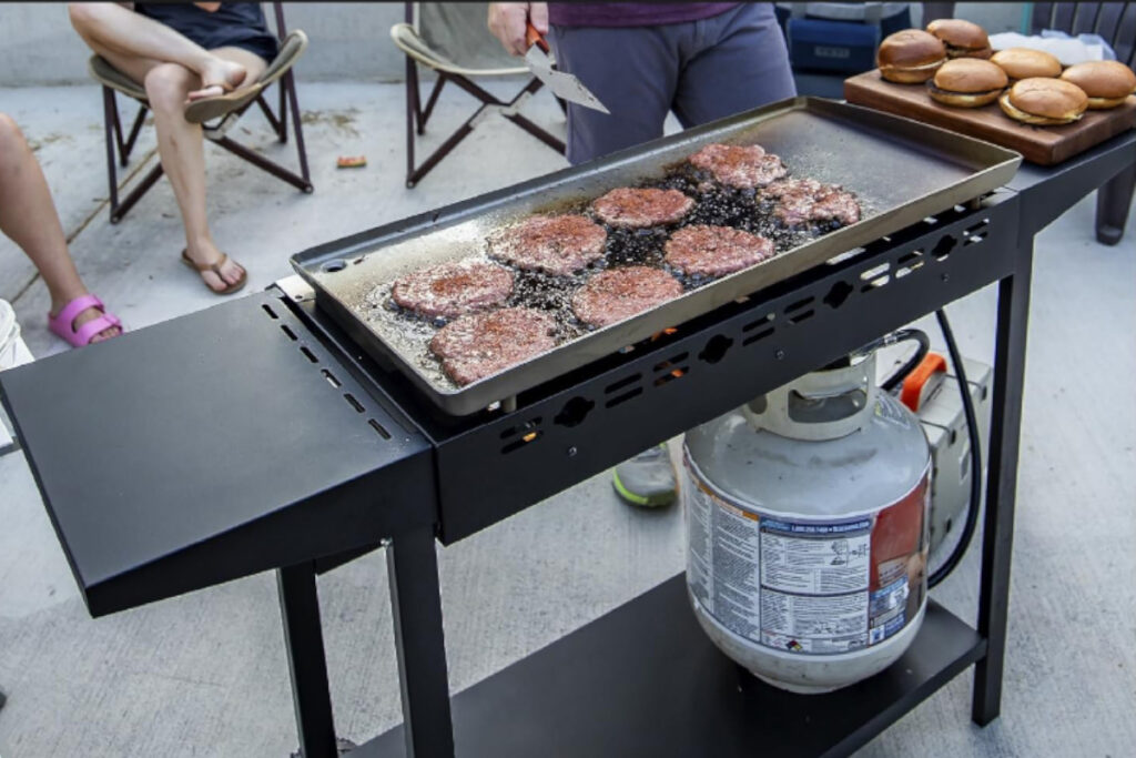 Gas One B-7400S Flat Top Grill showcasing its sleek design and versatile cooking surface, ideal for outdoor barbecues and family gatherings.