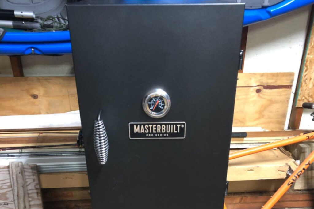 Masterbuilt MPS 230S Smoker - Premium outdoor electric smoker with adjustable temperature control, large cooking space, and smoke wood chip tray for perfect barbecuing and smoking recipes.