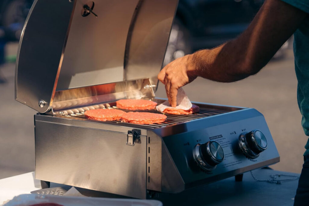 Monument Grills 13742 Tabletop Gas Grill - Compact and portable grilling solution perfect for outdoor cooking and tailgating.