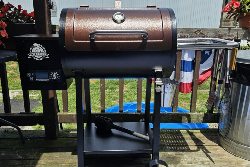 Pit Boss PB440D2 Wood Pellet Grill with premium features showcased in a vibrant outdoor setting, perfect for grilling enthusiasts seeking versatility and flavor in their cooking.