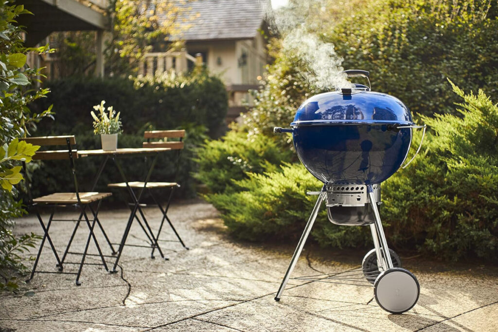 High-quality Weber Master-Touch Charcoal Grill showcasing its sleek design and innovative features, perfect for outdoor grilling enthusiasts.