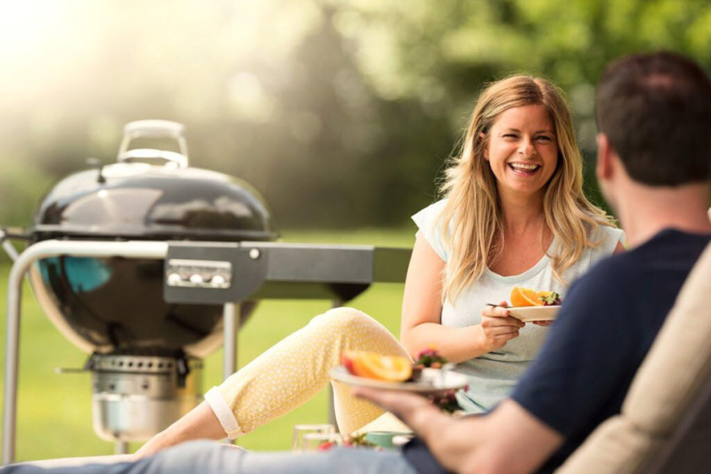 High-quality Weber Performer Charcoal Grill showcasing its sleek design and innovative features in outdoor cooking setup
