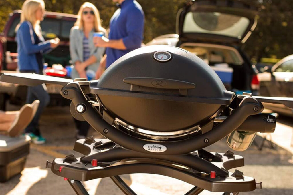 Webber Q1200 Liquid Propane Grill showcasing its sleek design, portable features, and cooking capabilities, perfect for outdoor barbecues and gatherings.