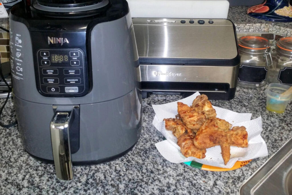 Ninja AF101 4-in-1 Air Fryer showcasing its sleek design and multiple cooking functions, ideal for healthy meal preparation and versatile cooking options.