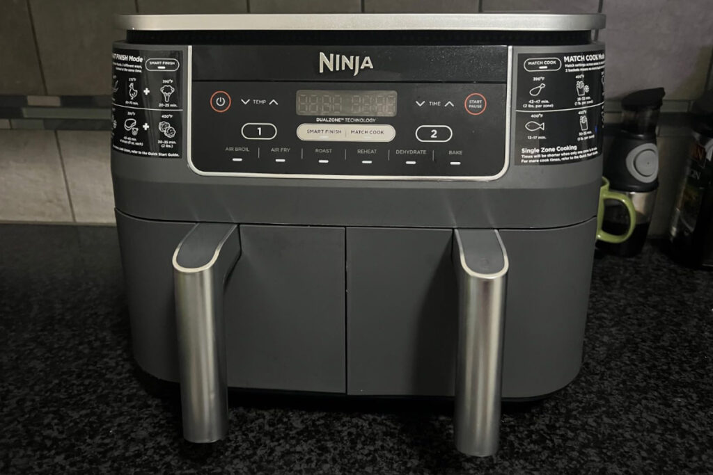 Upgrade your cooking with the Ninja DZ201 Foodi Air Fryer - a versatile kitchen appliance for healthier meals, featuring dual-zone technology for simultaneous cooking.