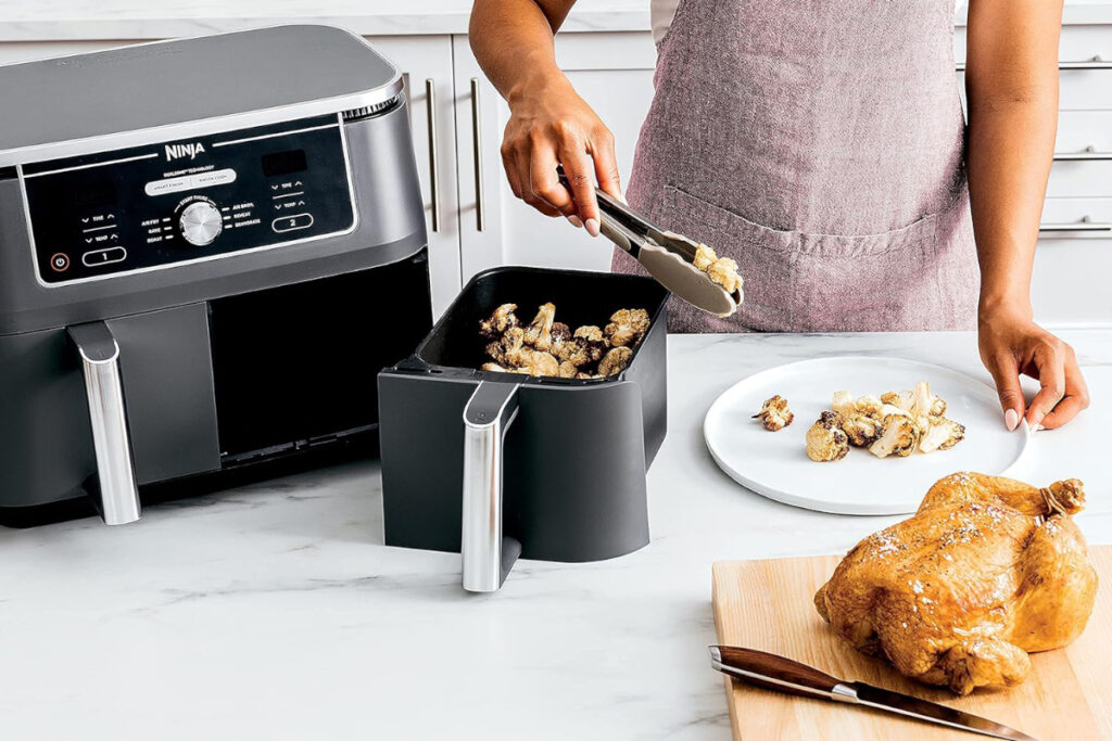 Alt text: "Ninja DZ401 Foodi 6-in-1 basket air fryer showcasing its versatile cooking features and sleek design, perfect for efficient meal preparation and healthier cooking options."